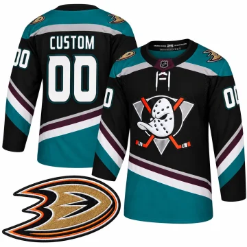 Front and back of a custom black jade and eggplant Anaheim Ducks 25th Anniversary jersey with CUSTOM 00 and one enlarged webbed D shoulder patch on white.