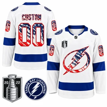 Front and back of white Tampa Bay Lightning custom Fourth of July 2022 hockey jersey with stars-and-stripes crest, CUSTOM and number 00, plus two enlarged real patches
